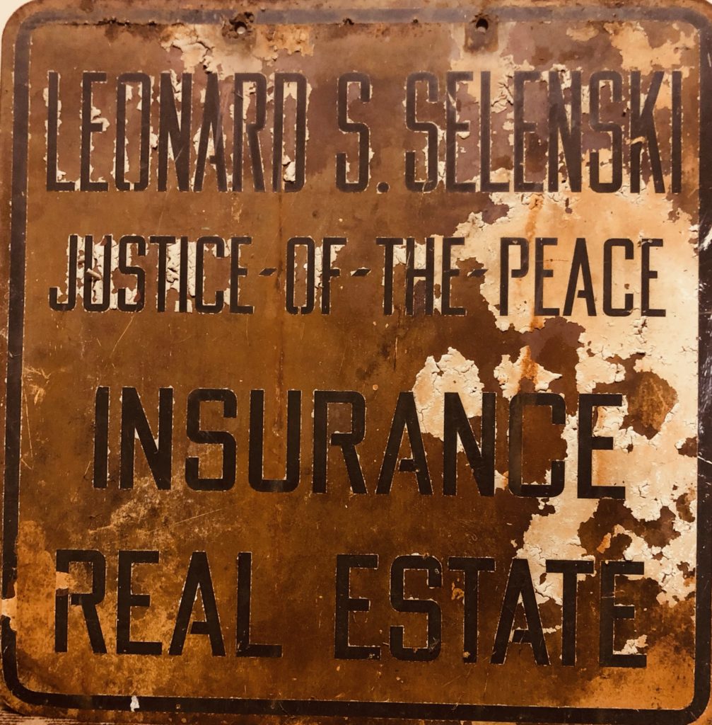Historic Leonard S. Selenski auto tag service sign in Wyoming, Pennsylvania